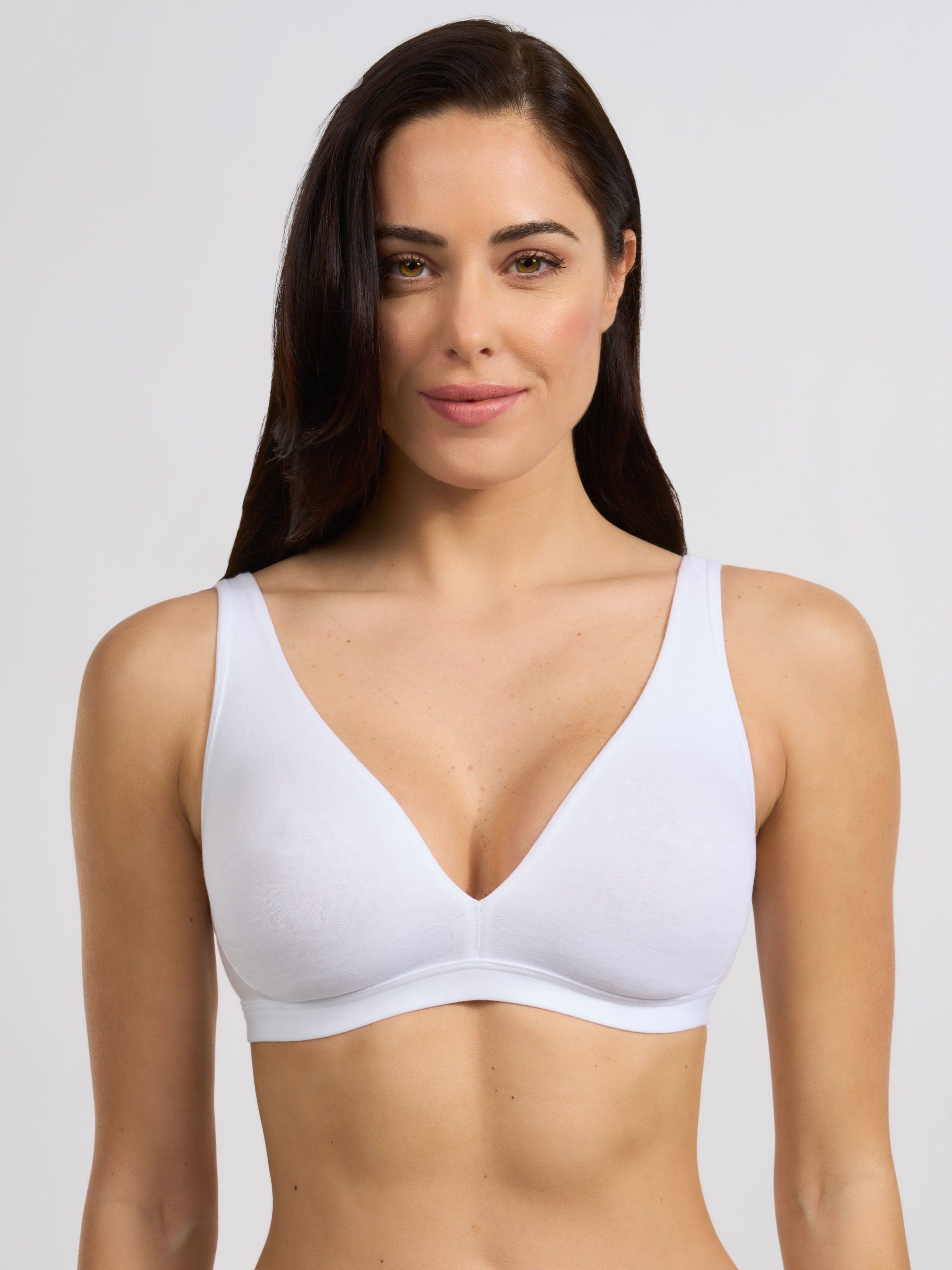Reggiseno bianco in cotone elasticizzato, modello vela con coppe preformate.