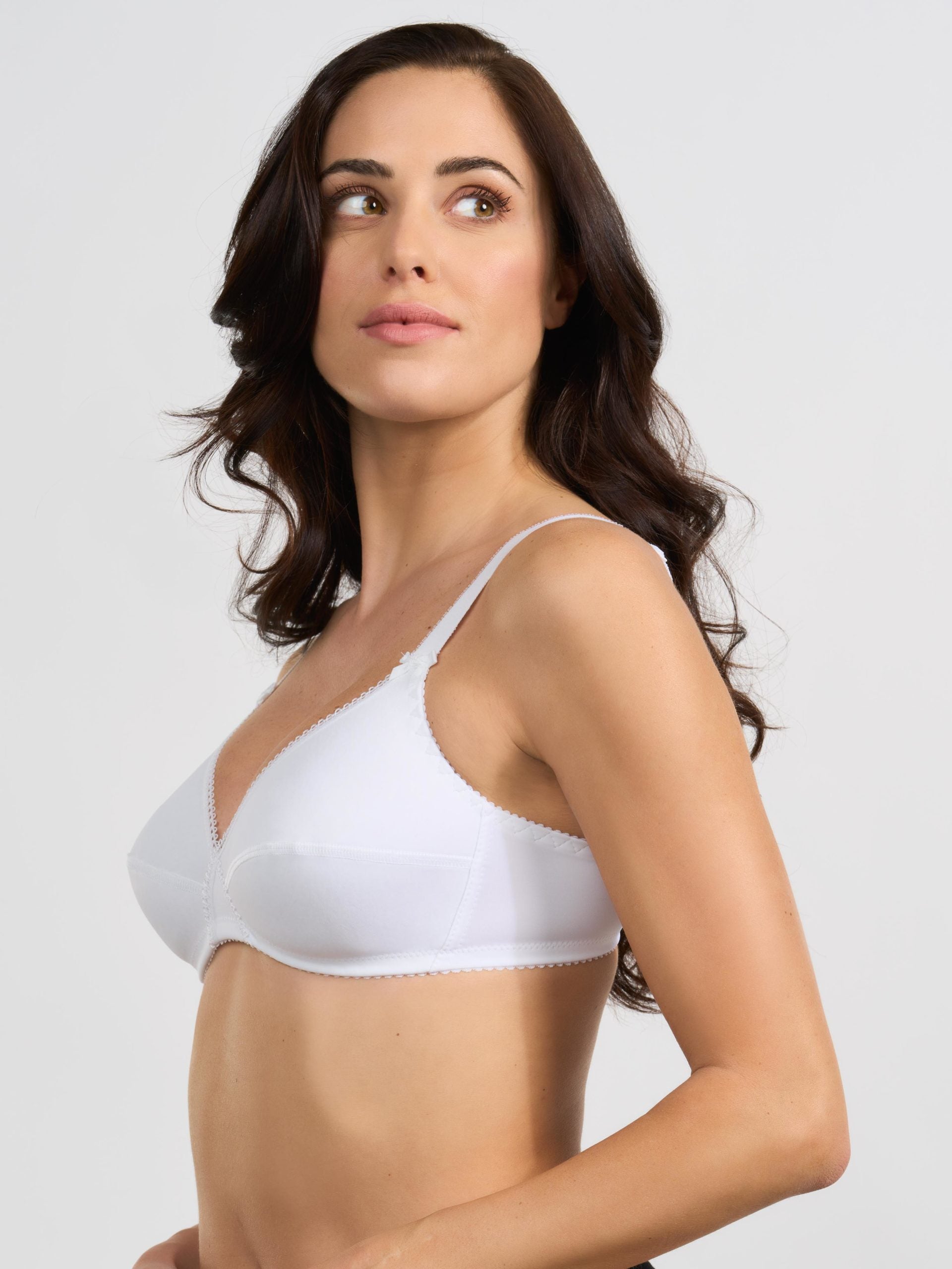Reggiseno bianco in tessuto elasticizzato con spalline sottili.