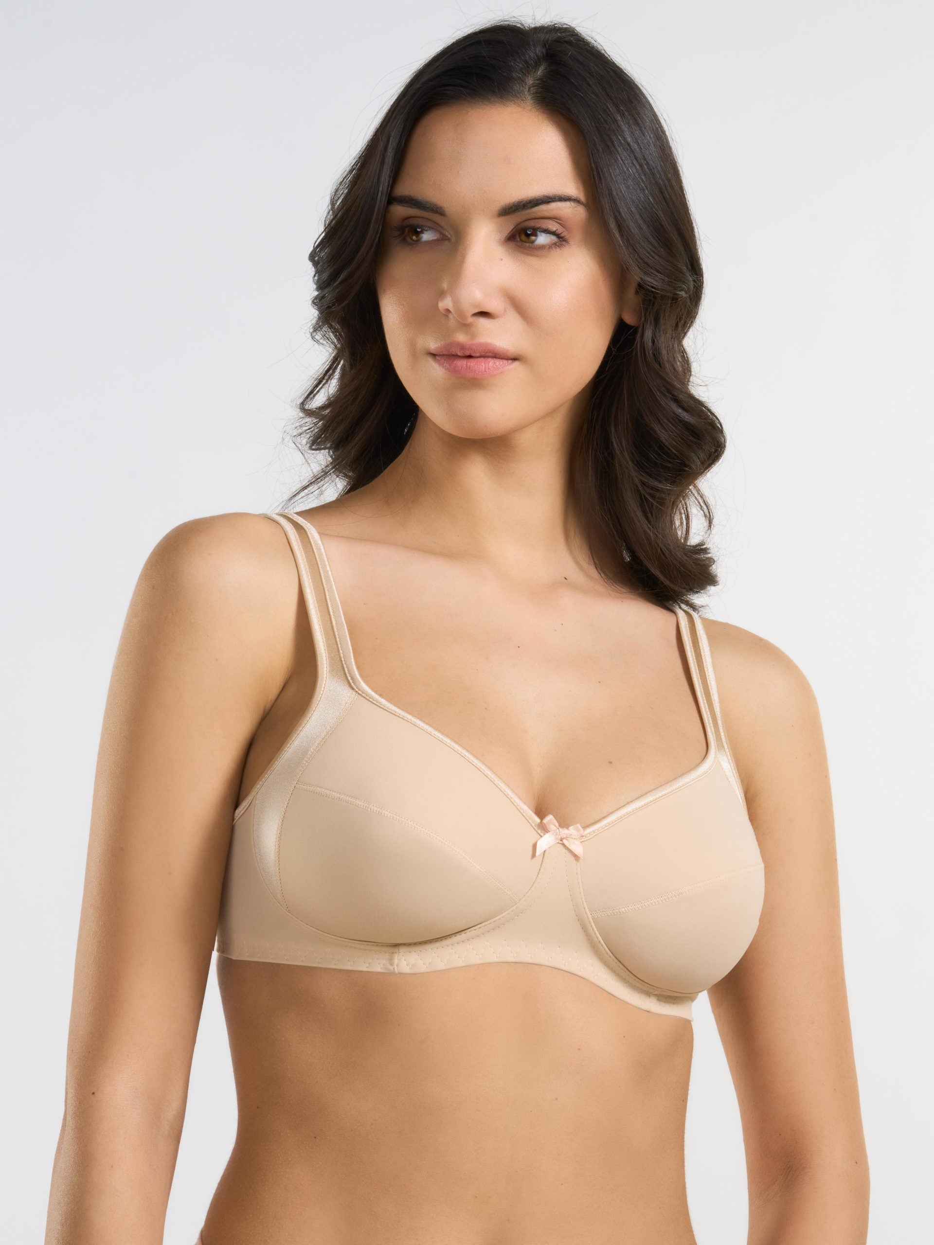 Reggiseno nude in tessuto elasticizzato con inserti in raso e fiocco centrale.