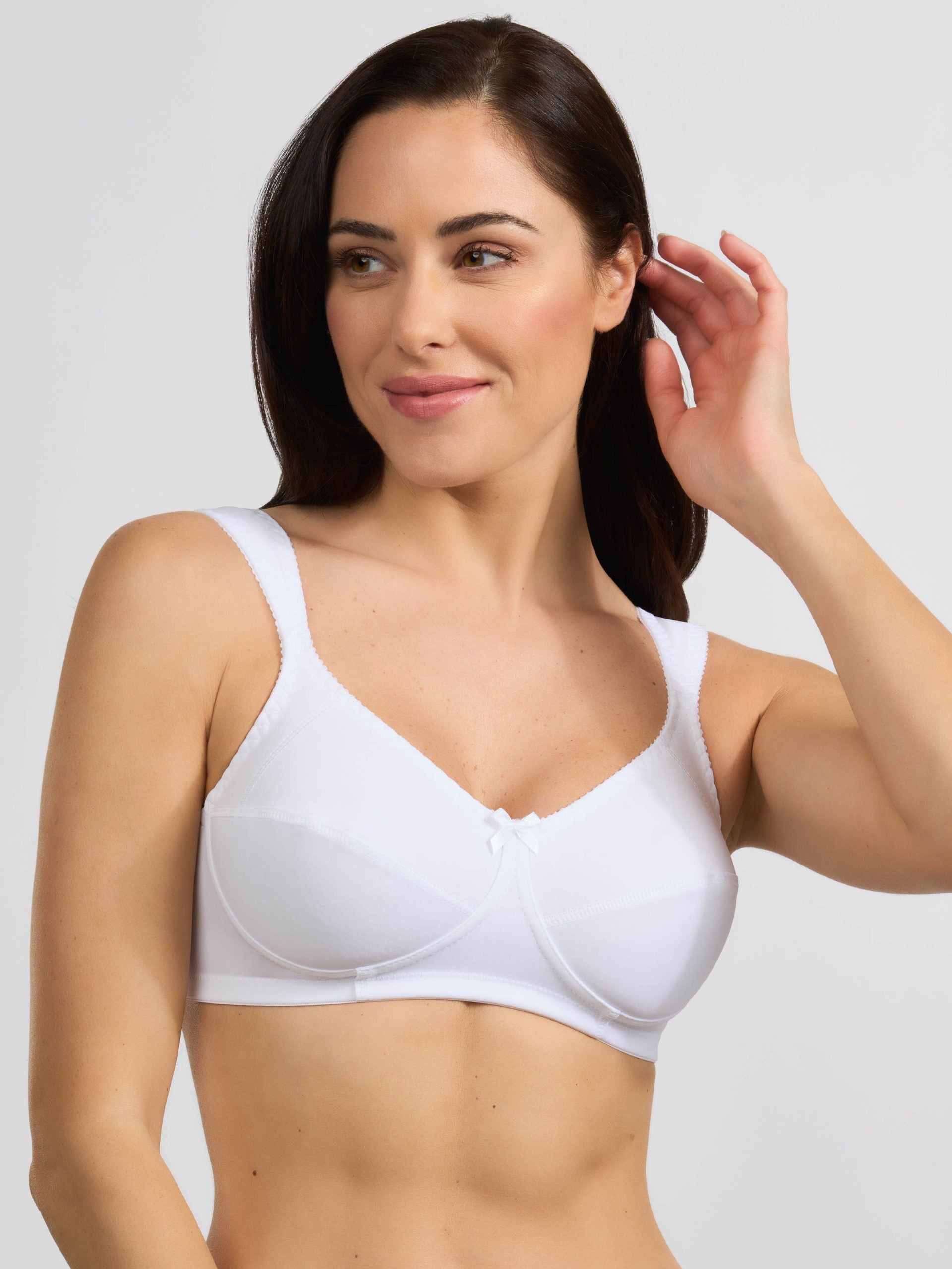 Reggiseno bianco elasticizzato con spallina anatomica imbottita e fiocco centrale.