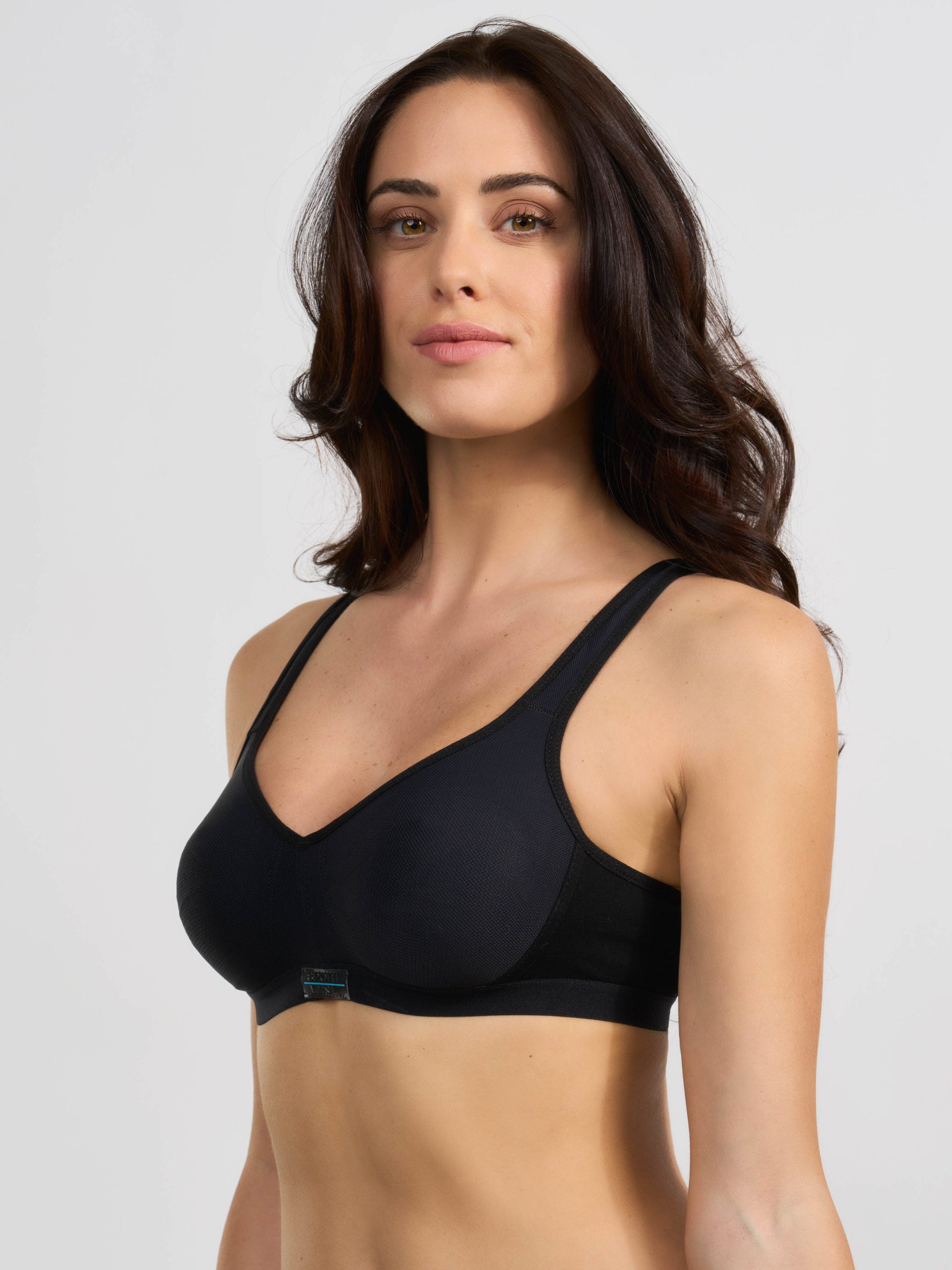 Reggiseno sportivo nero con coppe preformate senza cuciture.